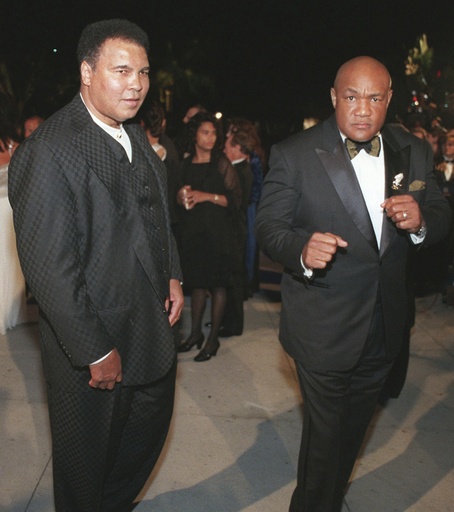 Muhammad Ali, left, and George Foreman arrive at a Vanity Fair Oscar party in West Hollywood, Calif, March 24, 1997. (AP Photo/E.J. Flynn, File)