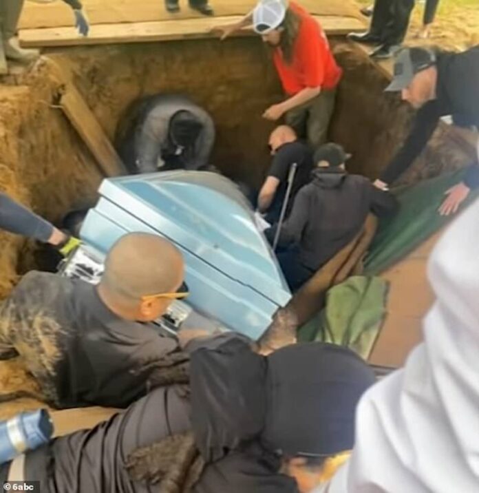 Family Falls into Grave